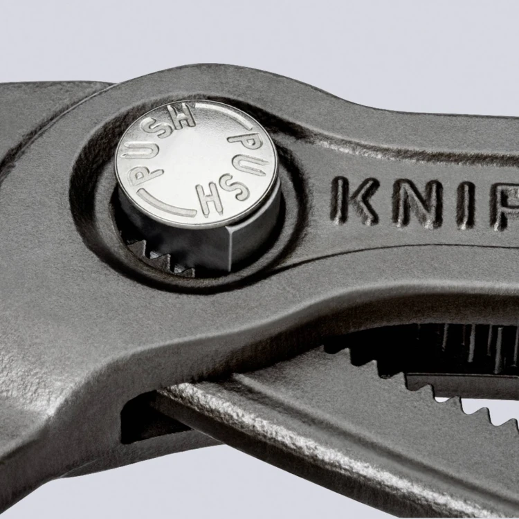 KNIPEX Cobra 87 03 125 – przycisk regulacji i wielostopniowa nastawa szczęk